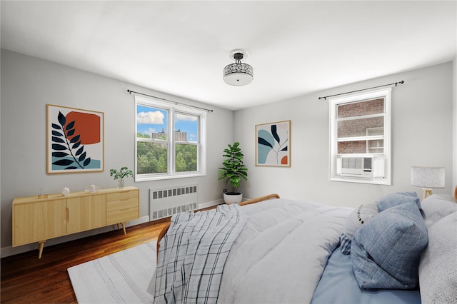 180 Van Cortlandt Park S Unit 4C, Bronx, NY 10463 - bedroom featuring radiator, dark wood-type flooring, baseboards, and cooling unit