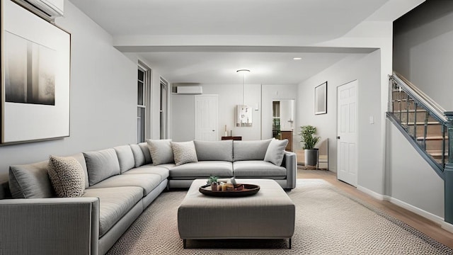 2448 Webb Ave, Bronx, NY 10468 - living area featuring a wall mounted AC, light wood-style flooring, stairway, recessed lighting, and baseboards