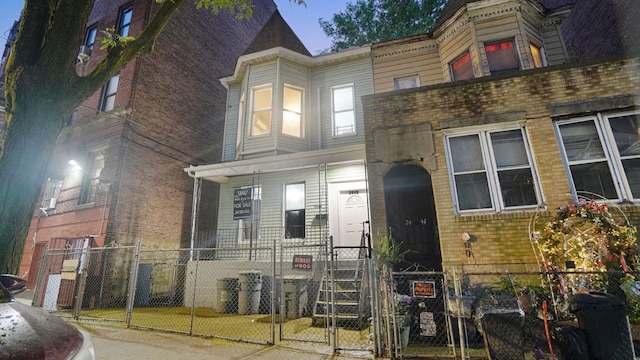 2448 Webb Ave, Bronx, NY 10468 - view of front of home with a gate, brick siding, and a fenced front yard