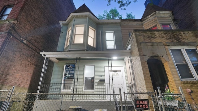2448 Webb Ave, Bronx, NY 10468 - view of side of property with covered porch, a gate, and a fenced front yard