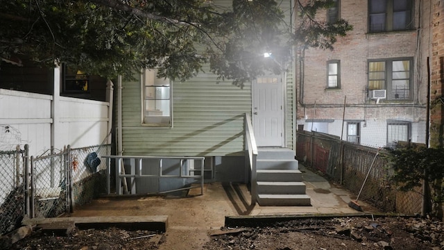 2448 Webb Ave, Bronx, NY 10468 - rear view of house with a fenced backyard and brick siding