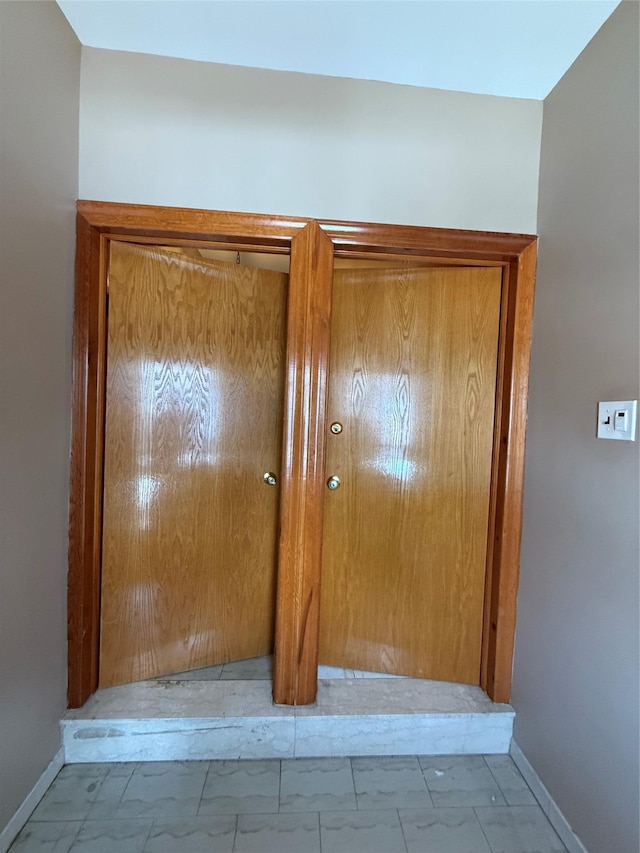 7542 67th Rd, Middle Village, NY 11379 - hall featuring baseboards and marble finish flooring