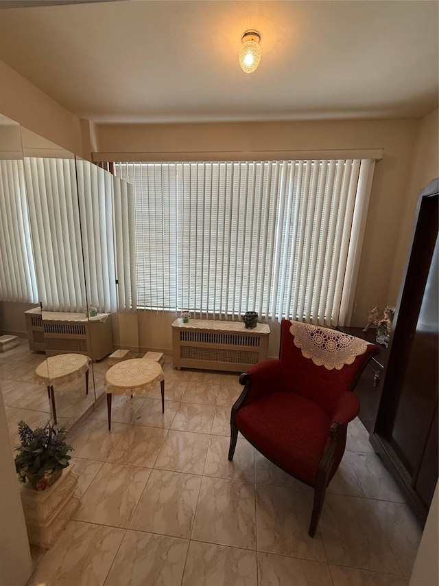 7542 67th Rd, Middle Village, NY 11379 - sitting room with light marble finish floors