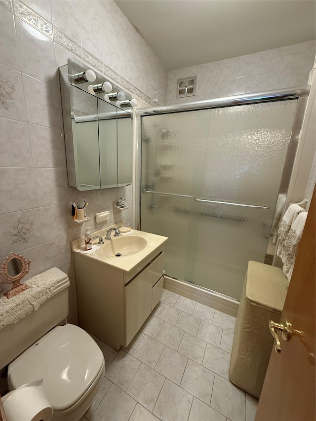 7542 67th Rd, Middle Village, NY 11379 - full bath with toilet, vanity, a stall shower, and tile patterned floors