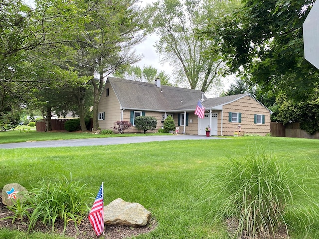 186 Montrose Dr, Port Jefferson Station, NY 11776 - view of front of home with a chimney, an attached garage, and driveway