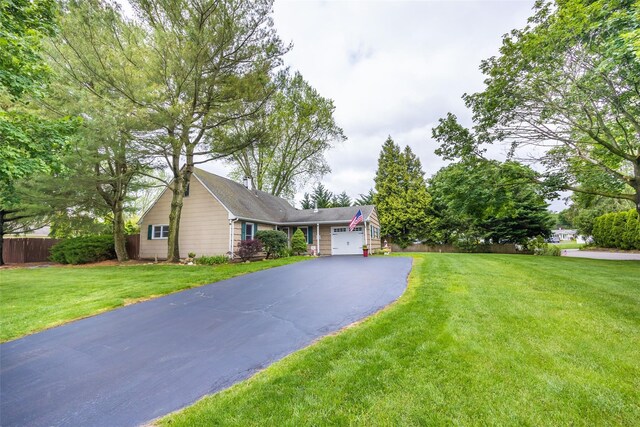 186 Montrose Dr, Port Jefferson Station, NY 11776 - view of front of house with asphalt driveway and a garage