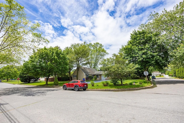 186 Montrose Dr, Port Jefferson Station, NY 11776 - view of asphalt road featuring traffic signs and curbs