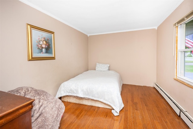 186 Montrose Dr, Port Jefferson Station, NY 11776 - bedroom featuring a baseboard radiator, wood finished floors, and crown molding