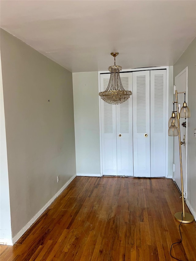 415 Gramatan Ave Unit 5D, Mount Vernon, NY 10552 - unfurnished dining area with wood-type flooring and baseboards