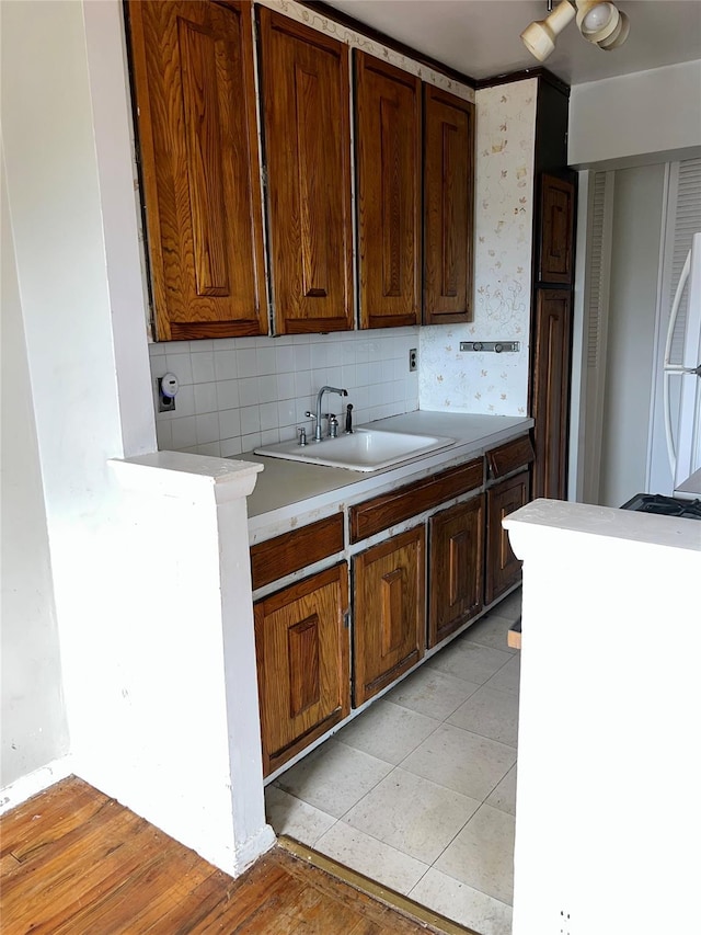 415 Gramatan Ave Unit 5D, Mount Vernon, NY 10552 - kitchen featuring a sink, backsplash, light countertops, freestanding refrigerator, and light wood-style flooring