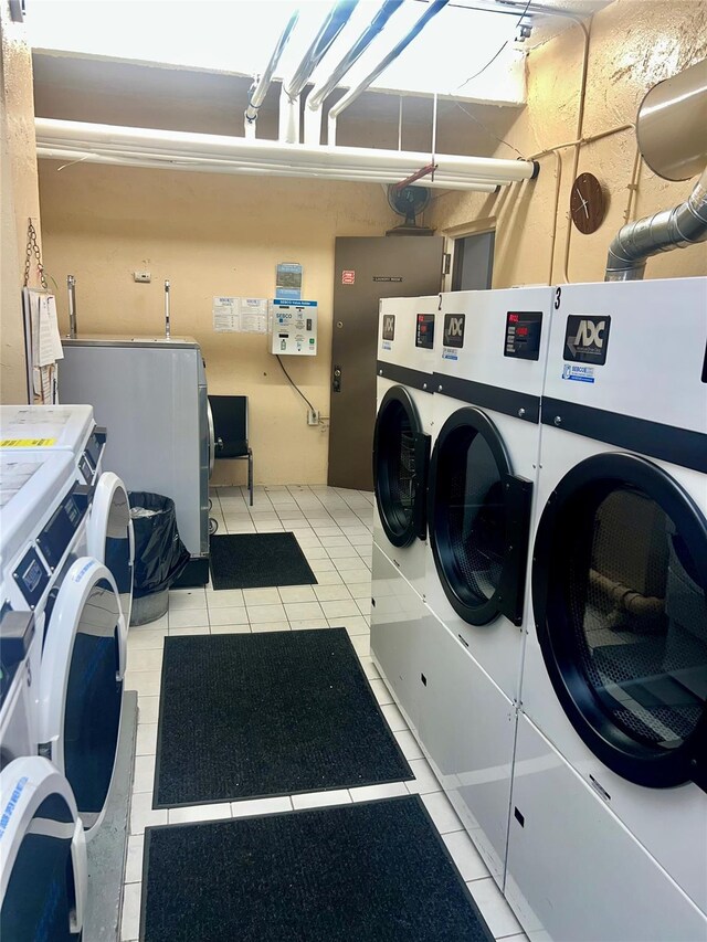 415 Gramatan Ave Unit 5D, Mount Vernon, NY 10552 - shared laundry room featuring washer and clothes dryer and light tile patterned flooring