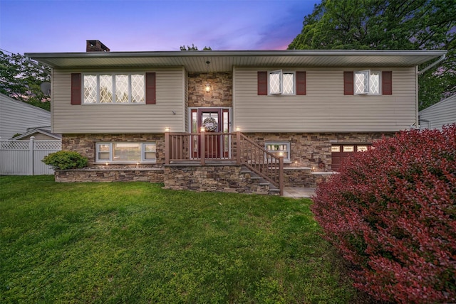 23 Waldron Dr, Stony Point, NY 10980 - raised ranch featuring stone siding, a garage, and a chimney