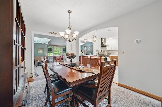 23 Waldron Dr, Stony Point, NY 10980 - dining area with a chandelier and arched walkways