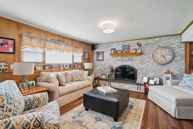 23 Waldron Dr, Stony Point, NY 10980 - living room featuring wood finished floors, wooden walls, ornamental molding, and a fireplace
