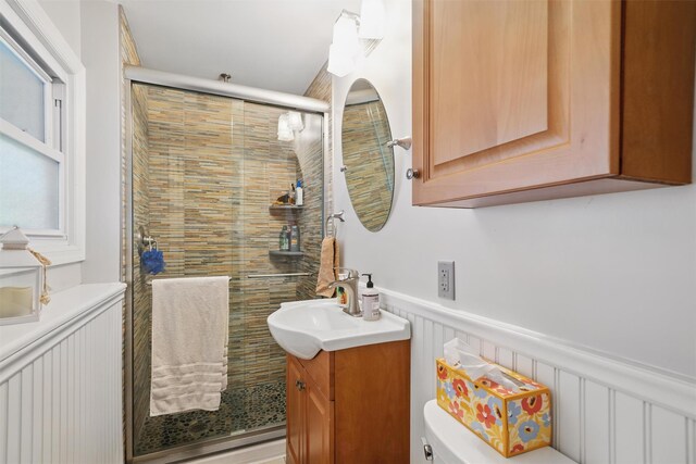 23 Waldron Dr, Stony Point, NY 10980 - bathroom featuring vanity, toilet, a shower stall, and wainscoting