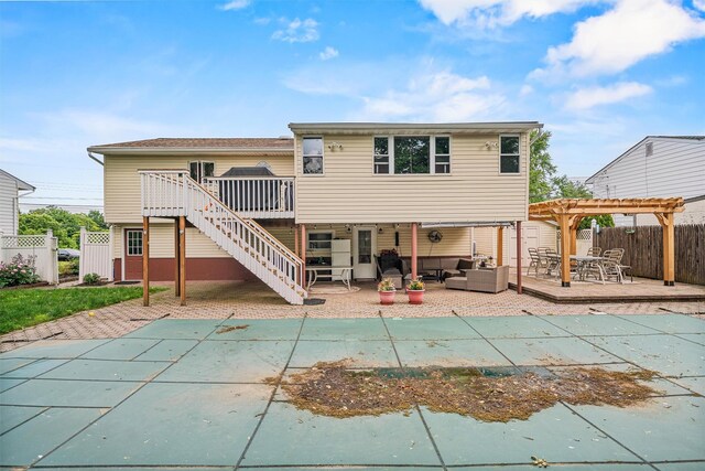 23 Waldron Dr, Stony Point, NY 10980 - back of property with a deck, a pergola, an outdoor hangout area, and a fenced backyard