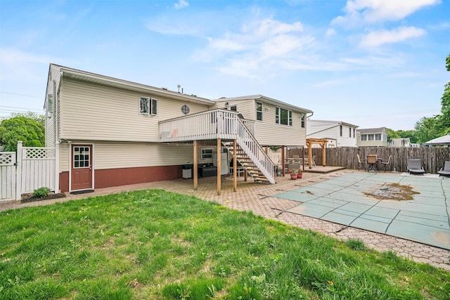 23 Waldron Dr, Stony Point, NY 10980 - back of property featuring stairway, a wooden deck, and a patio area