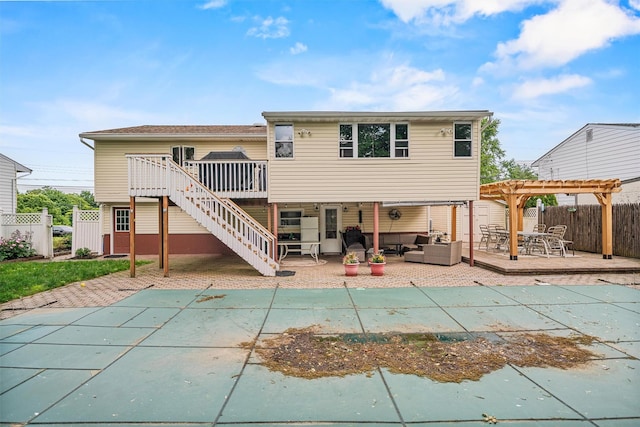 23 Waldron Dr, Stony Point, NY 10980 - back of property with a deck, a pergola, an outdoor hangout area, and a fenced backyard