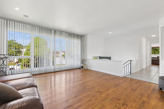 360 Robyn Pl, East Meadow, NY 11554 - living area featuring wood finished floors, attic access, and recessed lighting