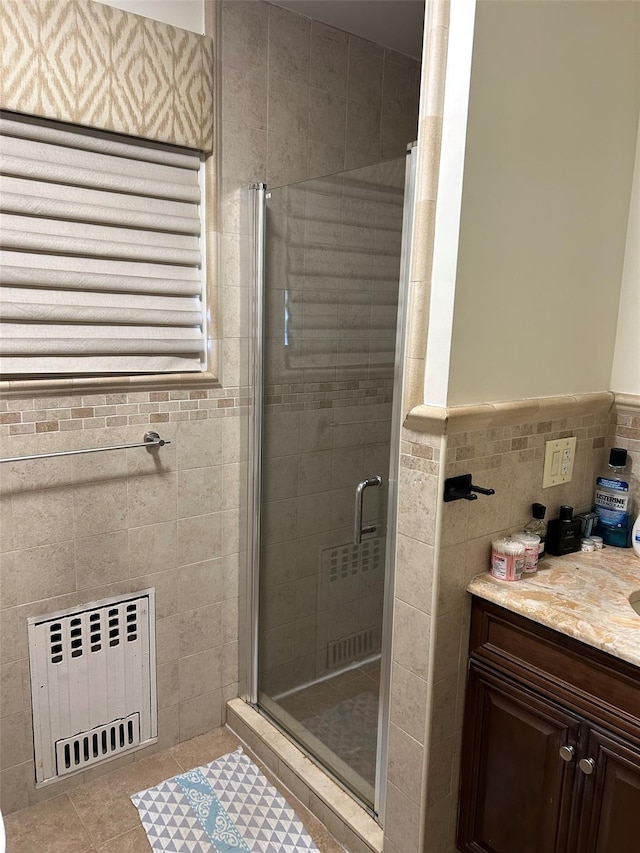 13-01 146th Pl, Whitestone, NY 11357 - bathroom featuring radiator, a shower stall, vanity, and tile walls