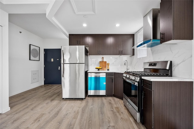 97-30 64th Ave Unit 3B, Rego Park, NY 11374 - kitchen with appliances with stainless steel finishes, wall chimney exhaust hood, dark brown cabinetry, light countertops, and recessed lighting