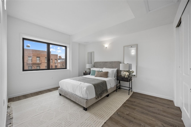 97-30 64th Ave Unit 3B, Rego Park, NY 11374 - bedroom featuring dark wood-type flooring, baseboards, and a closet