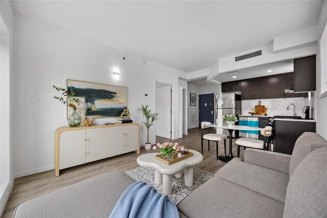 97-30 64th Ave Unit 3C, Rego Park, NY 11374 - living room with light wood finished floors and baseboards