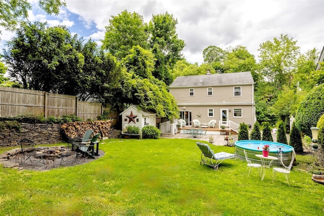 395 Main St, Northport, NY 11768 - back of property featuring an outdoor fire pit