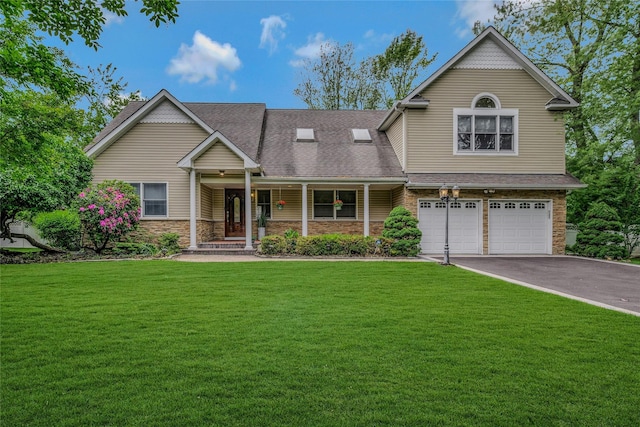 32 Robinhood Ln, East Setauket, NY 11733 - view of front facade with an attached garage, driveway, a porch, a front lawn, and roof with shingles