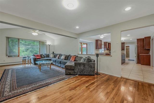 32 Robinhood Ln, East Setauket, NY 11733 - living room with a ceiling fan, light wood-style floors, recessed lighting, baseboards, and a baseboard heating unit