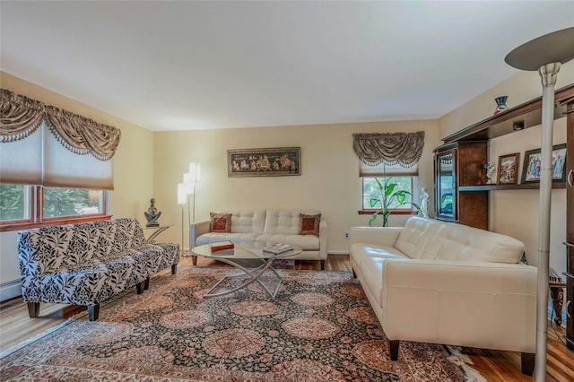 32 Robinhood Ln, East Setauket, NY 11733 - living area featuring wood finished floors and baseboards
