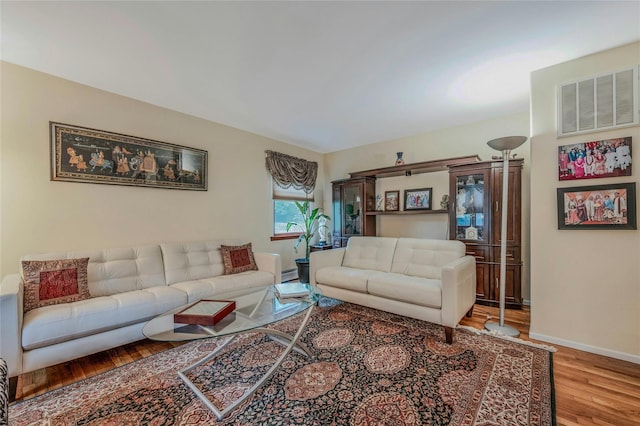 32 Robinhood Ln, East Setauket, NY 11733 - living area with wood finished floors and baseboards