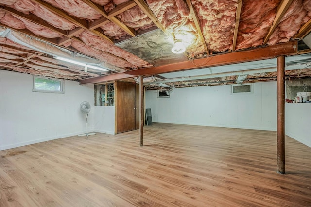 32 Robinhood Ln, East Setauket, NY 11733 - below grade area featuring wood finished floors