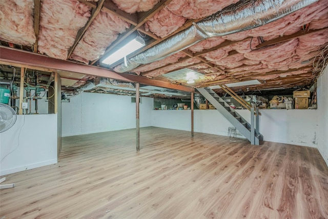 32 Robinhood Ln, East Setauket, NY 11733 - unfinished below grade area featuring stairs and wood finished floors