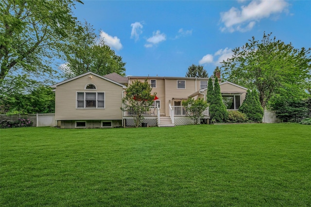 32 Robinhood Ln, East Setauket, NY 11733 - rear view of property with a deck and a chimney