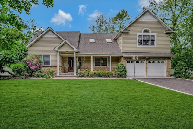 32 Robinhood Ln, East Setauket, NY 11733 - view of front facade featuring an attached garage, driveway, covered porch, and a front yard