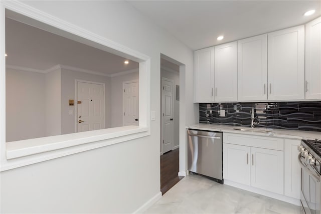 380 N Broadway Unit D4, Yonkers, NY 10701 - kitchen featuring appliances with stainless steel finishes, a sink, recessed lighting, white cabinetry, and crown molding
