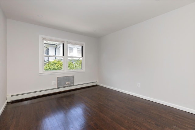 380 N Broadway Unit D4, Yonkers, NY 10701 - spare room featuring a baseboard radiator, baseboards, and dark wood-style flooring