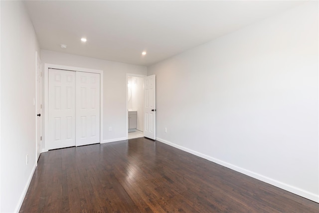 380 N Broadway Unit D4, Yonkers, NY 10701 - unfurnished bedroom with baseboards, dark wood-type flooring, a closet, recessed lighting, and ensuite bathroom