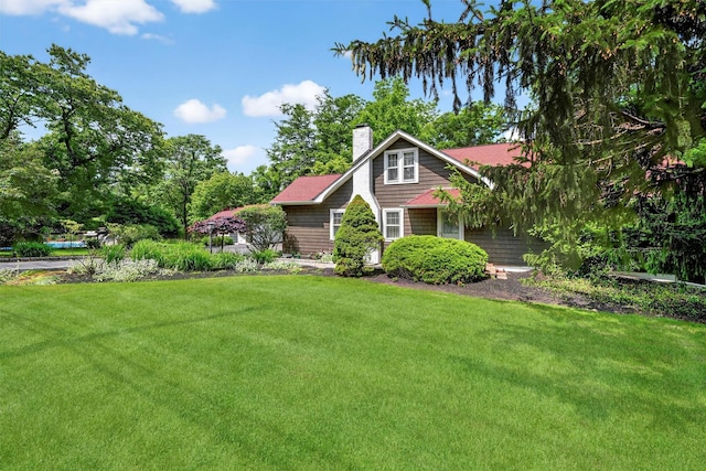 51 S Airmont Rd, Airmont, NY 10901 - view of front of property with a chimney and a front lawn