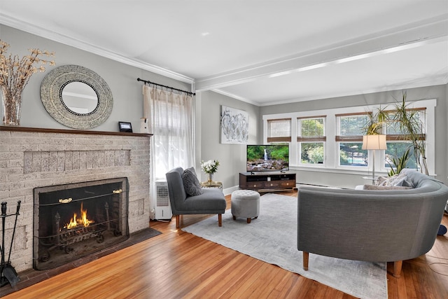 51 S Airmont Rd, Airmont, NY 10901 - living room with a brick fireplace, wood finished floors, ornamental molding, and beam ceiling