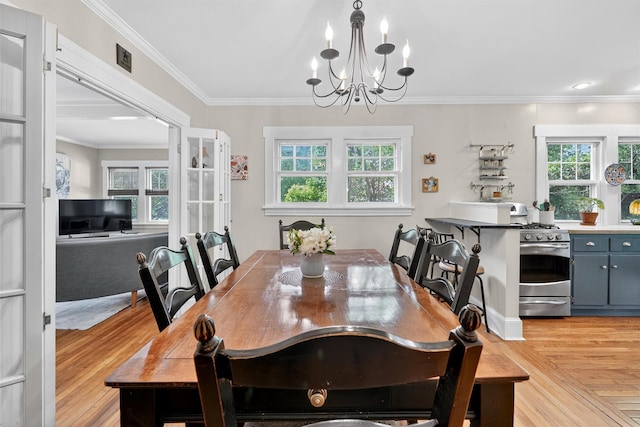 51 S Airmont Rd, Airmont, NY 10901 - dining room featuring light wood finished floors, a chandelier, and crown molding