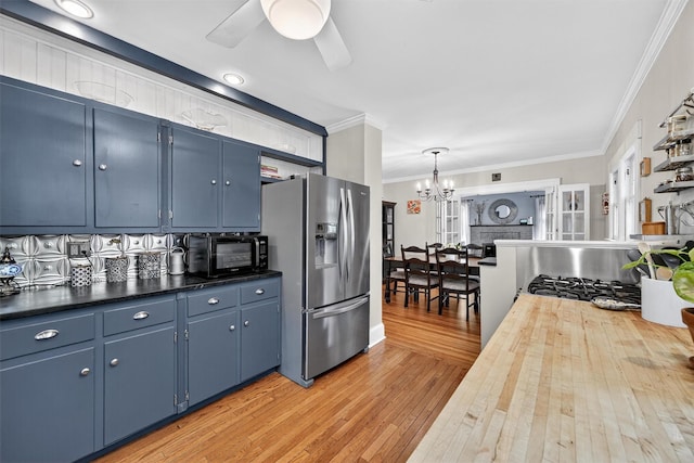 51 S Airmont Rd, Airmont, NY 10901 - kitchen featuring stainless steel refrigerator with ice dispenser, a chandelier, ornamental molding, blue cabinets, and light wood finished floors