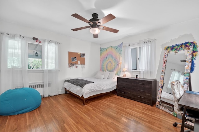 51 S Airmont Rd, Airmont, NY 10901 - bedroom with radiator heating unit, light wood finished floors, and a ceiling fan