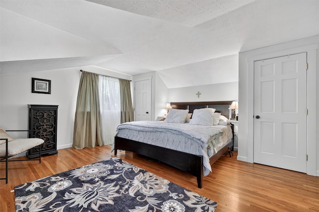 51 S Airmont Rd, Airmont, NY 10901 - bedroom featuring vaulted ceiling and light wood finished floors