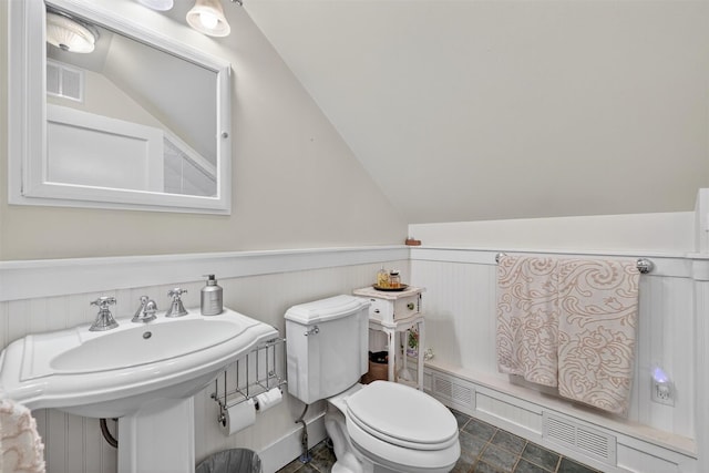 51 S Airmont Rd, Airmont, NY 10901 - bathroom featuring wainscoting and lofted ceiling