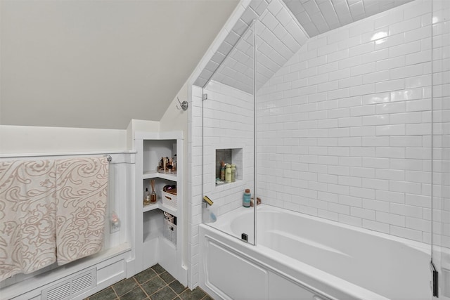 51 S Airmont Rd, Airmont, NY 10901 - bathroom with lofted ceiling, tile patterned floors, and bathing tub / shower combination