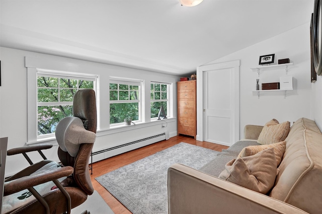 51 S Airmont Rd, Airmont, NY 10901 - living room featuring baseboard heating, lofted ceiling, wood finished floors, and healthy amount of natural light