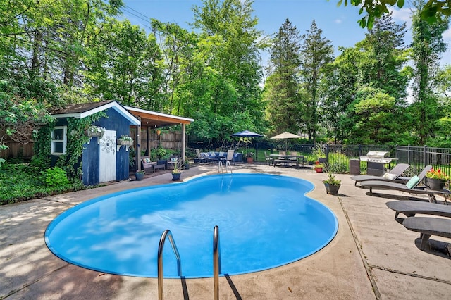 51 S Airmont Rd, Airmont, NY 10901 - view of pool with a patio area, a shed, outdoor dining space, and view of wooded area