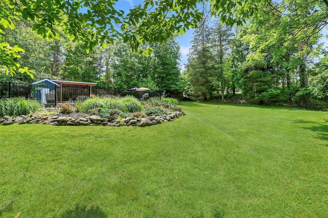 51 S Airmont Rd, Airmont, NY 10901 - view of yard with an outdoor structure and view of wooded area